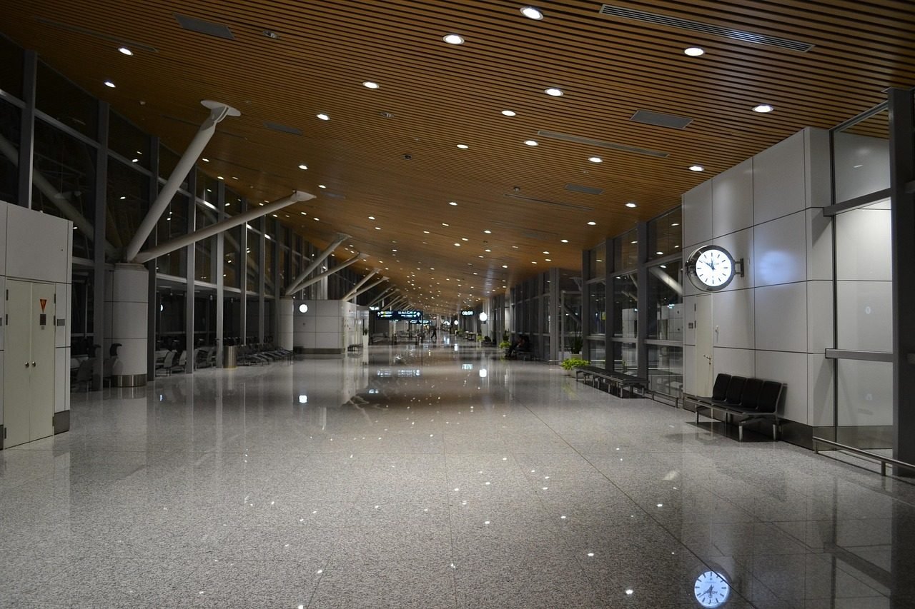Airport terminal gate area where a group leader would gather pilgrims after arrival