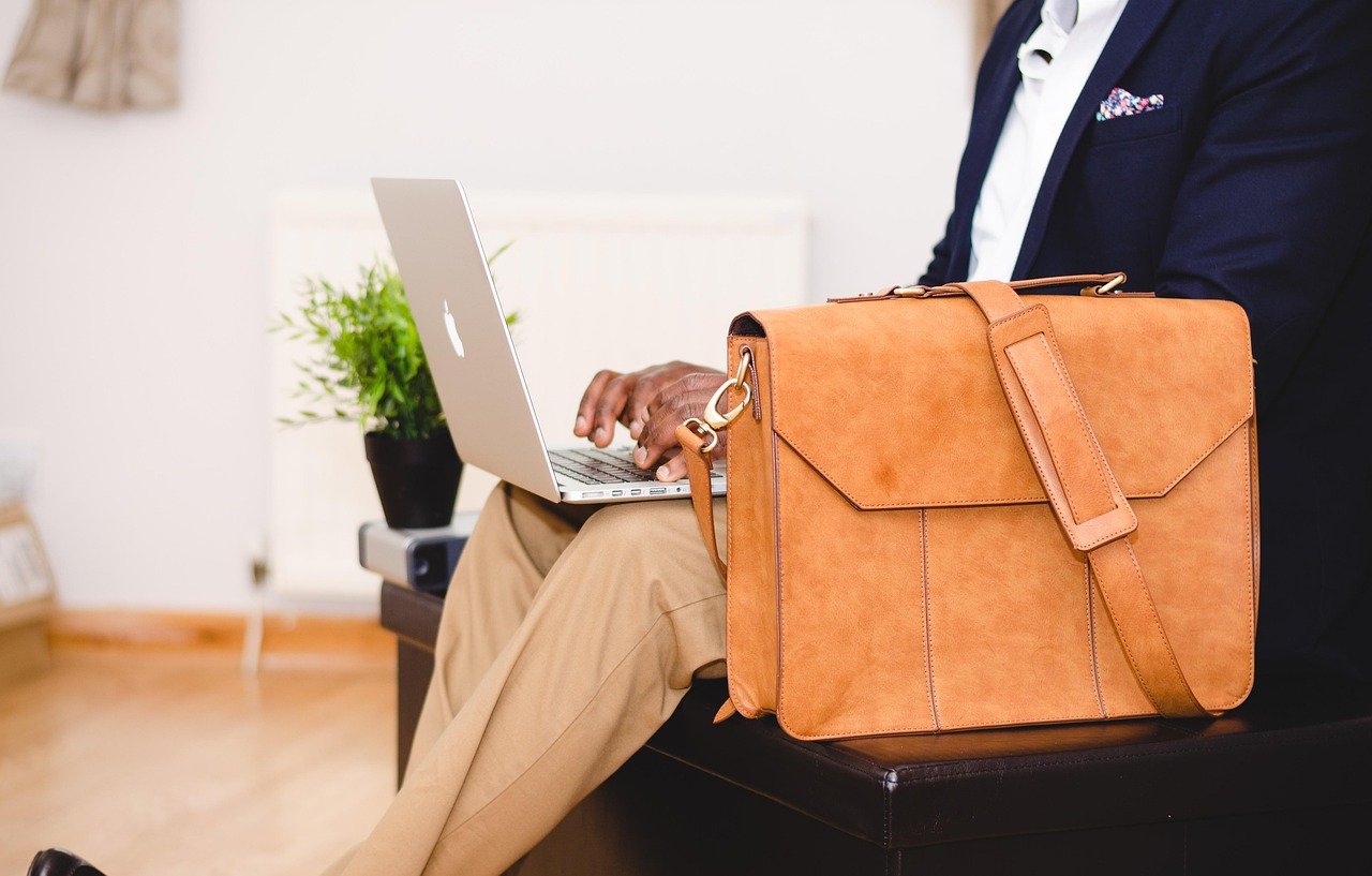 Business traveller with a laptop bag waiting before a flight
