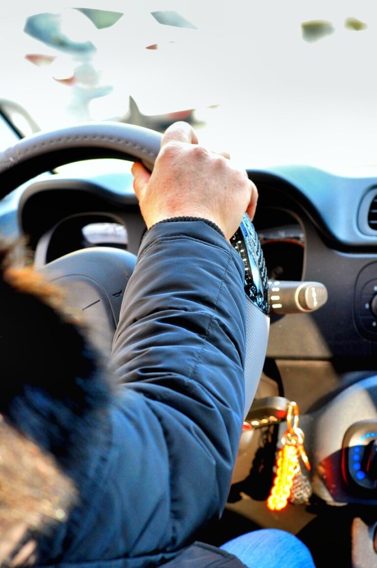 Drivers seat and steering wheel inside a pre-booked taxi in Saudi Arabia