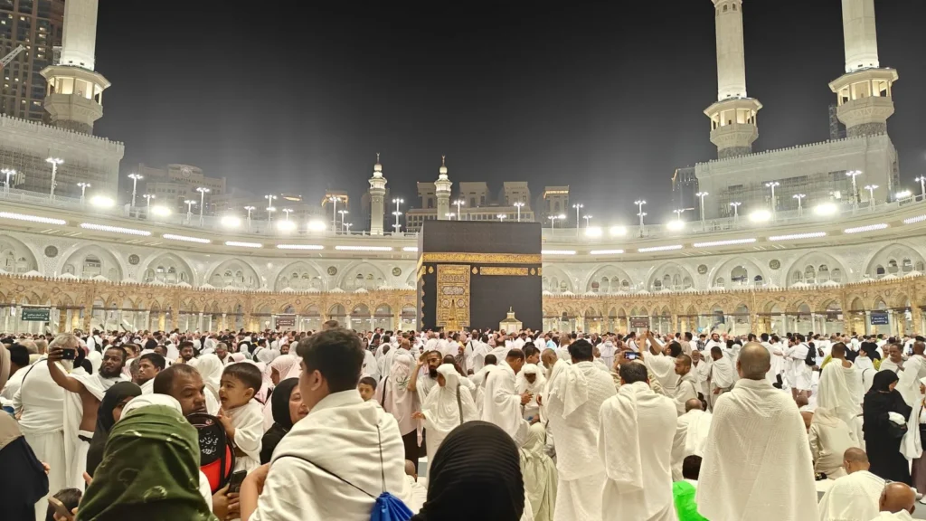 Pilgrims gathered around the Kaaba in Makkah at night