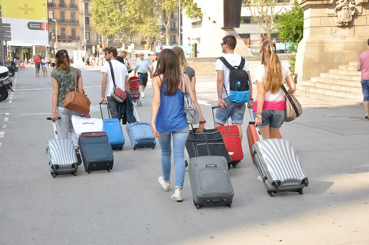 Multiple suitcases belonging to a large family group preparing for Hajj travel