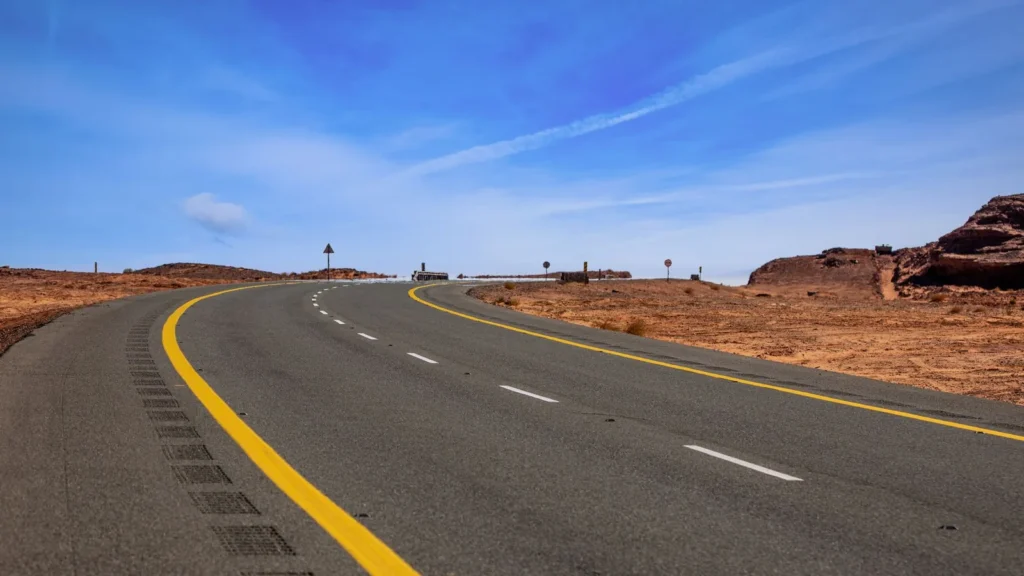 Curved highway cutting through the desert near Tayma, Saudi Arabia
