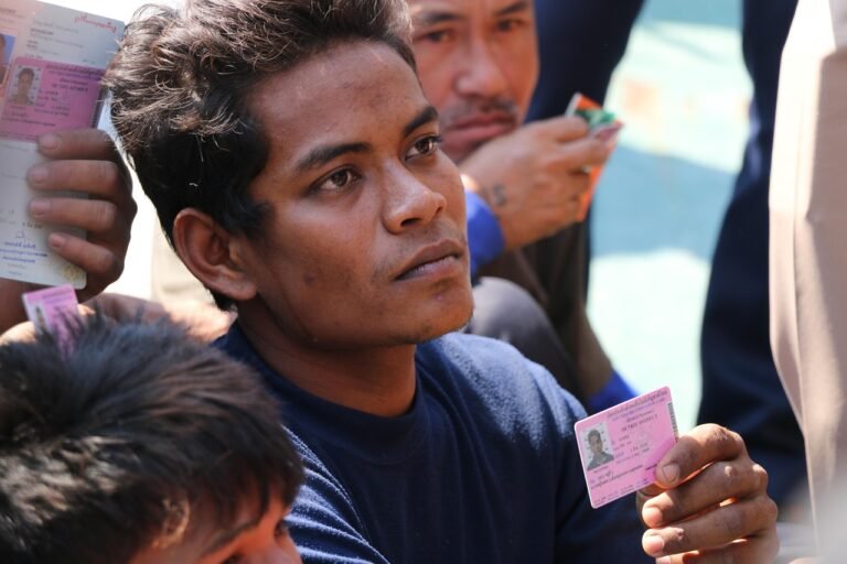 Pilgrim holding an official identification card during Hajj registration
