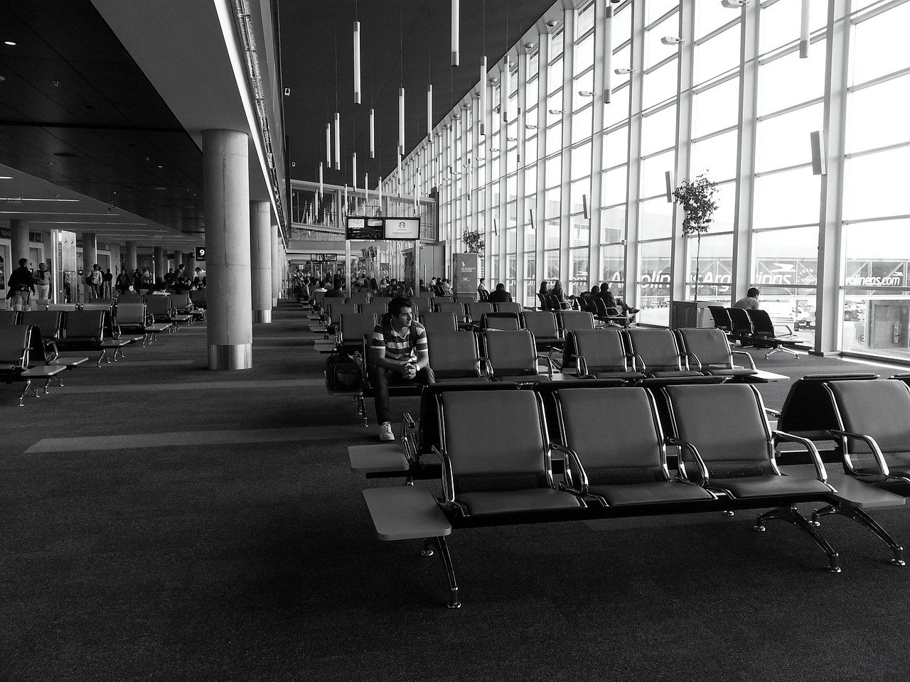 Pilgrim considering next steps at an airport after a travel document issue