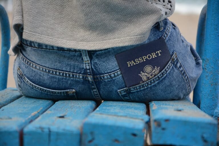 Travel documents including a passport representing what to carry during an Umrah trip