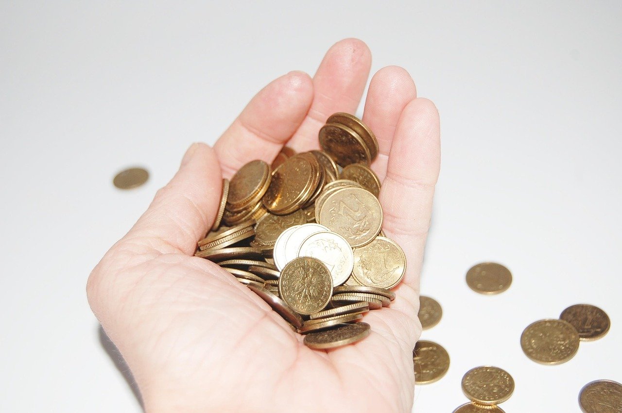 Cash being held in hand representing a tip payment