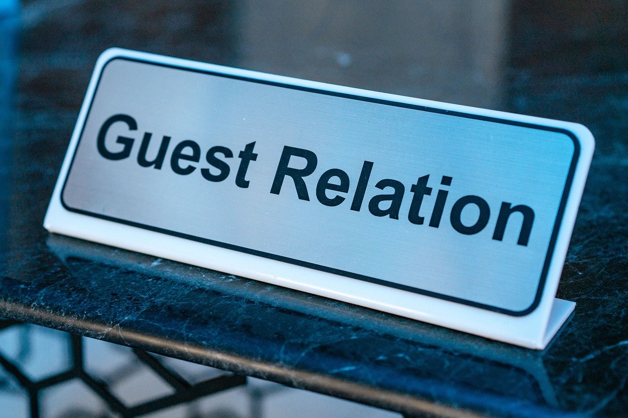 Hotel reception style help desk representing where pilgrims can seek assistance