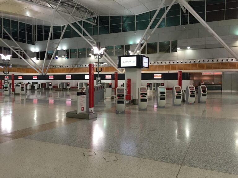 An airport arrivals area where pilgrims meet their pre-booked driver