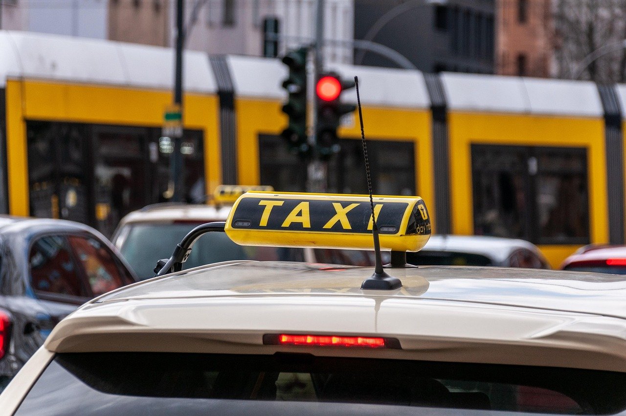 Taxi vehicle on a city street representing licensed Saudi transport