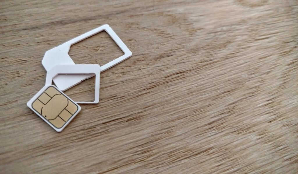 Saudi SIM card being prepared for use on arrival to coordinate with pre-booked transport